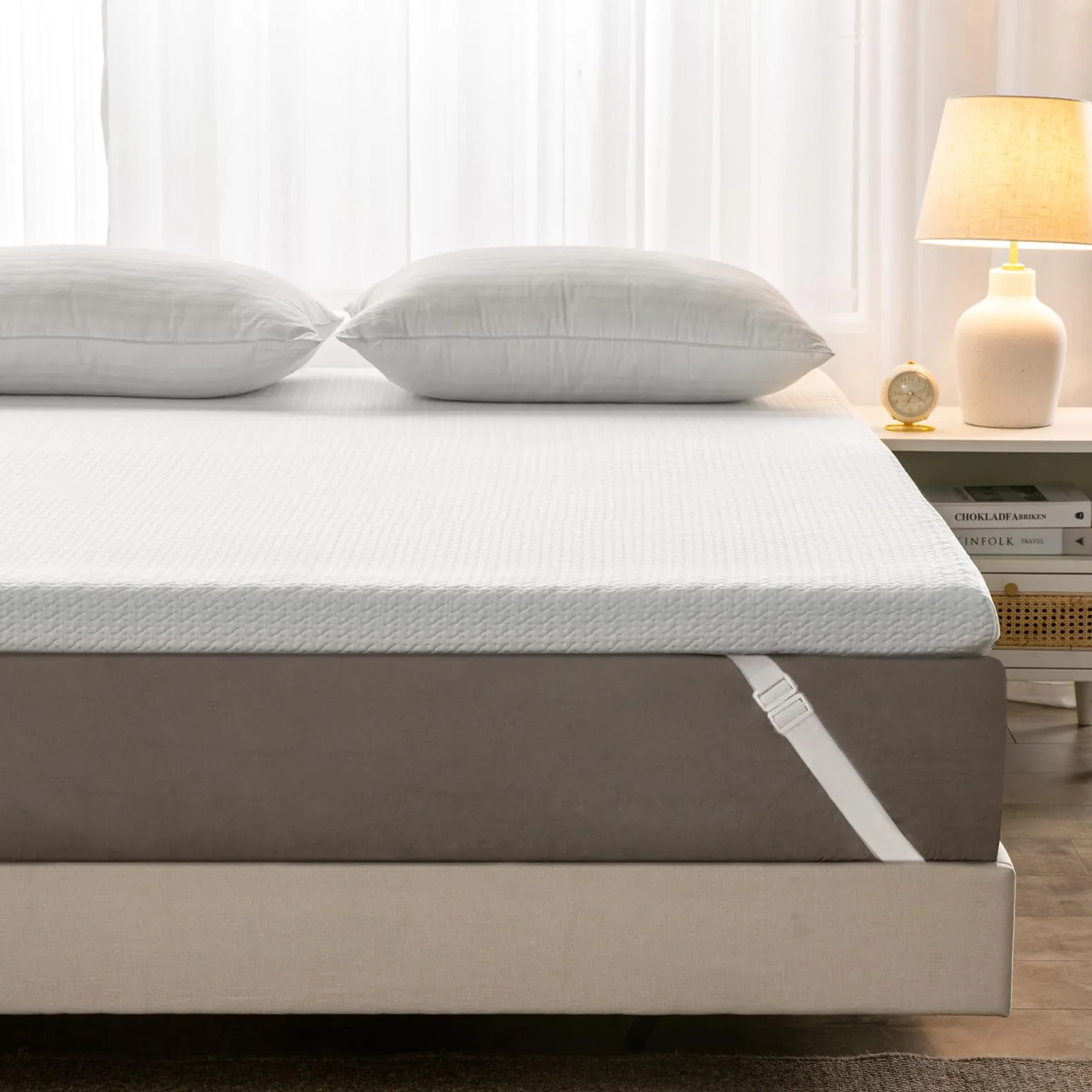 Uspark 7 cm gel memory foam mattress topper: a white topper with a bamboo cover and corner bands, on a double bed